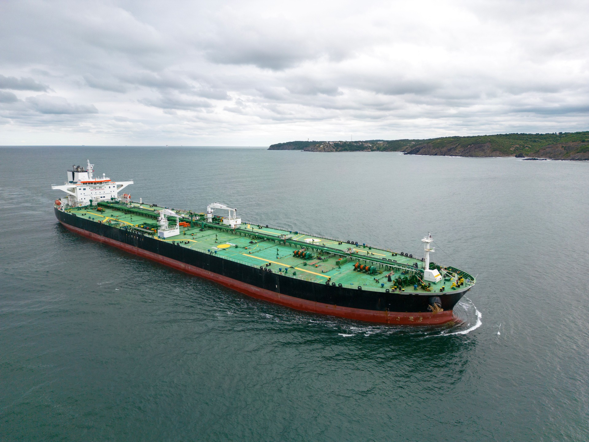 Aerial view of Oil ship tanker transportation crude oil from refinery on the sea.